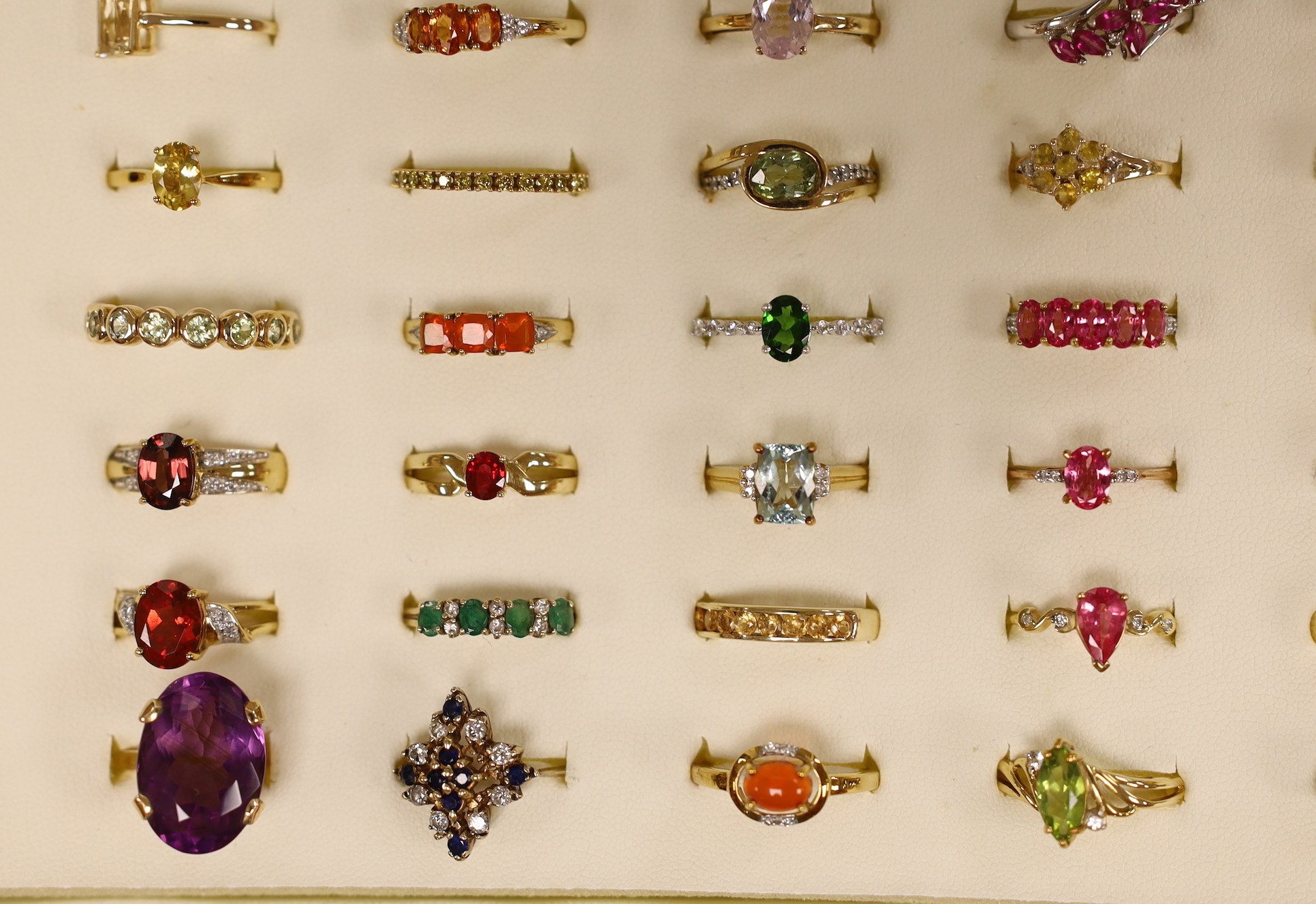 Forty seven assorted modern 9ct gold and gem set dress rings, including amethyst, citrine and garnet, two stamped 10k and one 9k and three 18ct gold and gem set dress rings, in ring box.